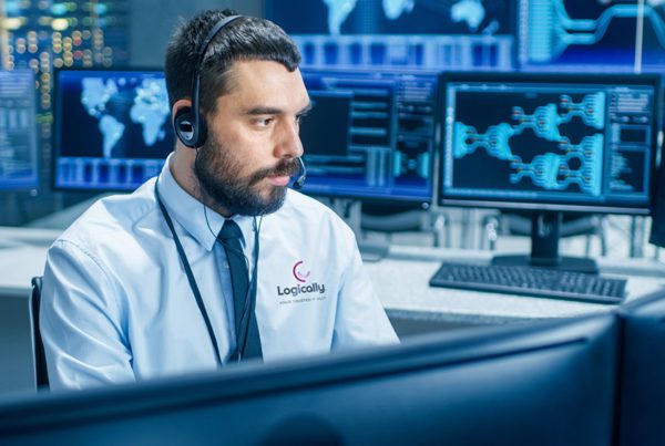 In the System Monitoring Room Dispatcher Wearing Headset Observes Proper Functioning of the Facility. He's Surrounded by Screen Showing Technical Data.