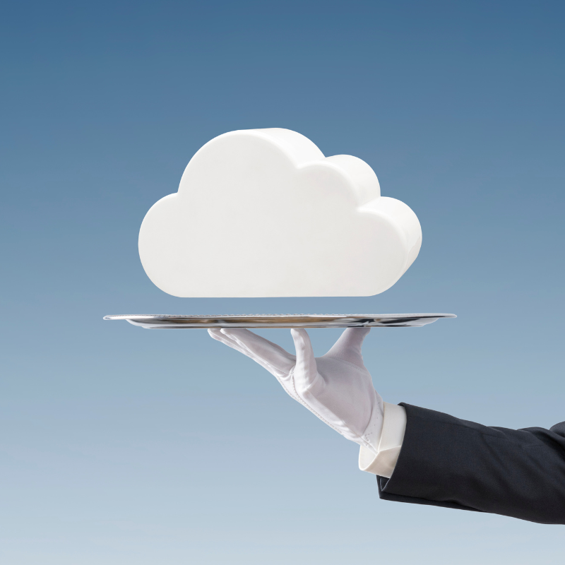 A hand wearing a glove holding a tray below a computer icon