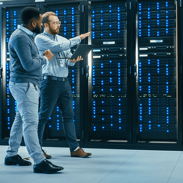 two it experts check a server room